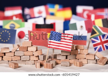 American flag in front of a wall and flags of other countries Royalty-Free Stock Photo #605419427