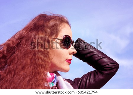 Girl with curly hair looking into the distance