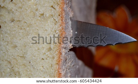 cutting bread Royalty-Free Stock Photo #605434424