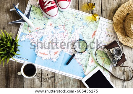 Travel planning concept on map Royalty-Free Stock Photo #605436275