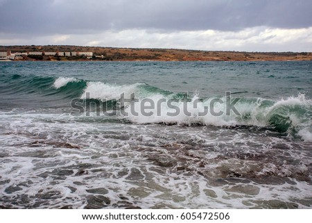 Nature seascape background: blue and turquoise sea with mountains and sky over it.
Malta