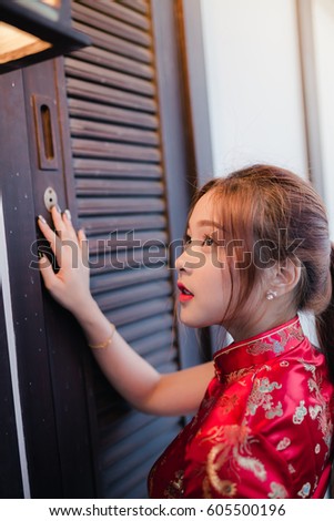 Young asian girl beautiful smiling in the qipao chinese dress is in new year