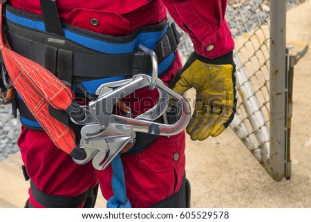 High rescue equipment ,Fireman in climbing equipment for rescue . Royalty-Free Stock Photo #605529578
