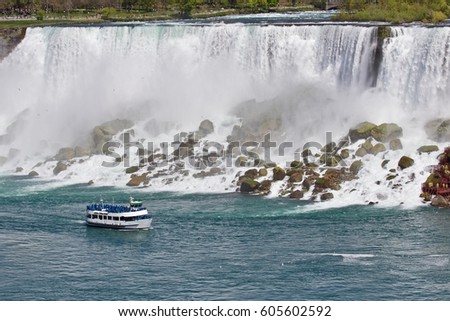 Beautiful photo of a ship near amazing Niagara waterfall