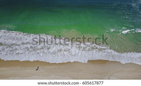 Aerial view over the white sand beach and clear ocean water in Perth, Australia. 