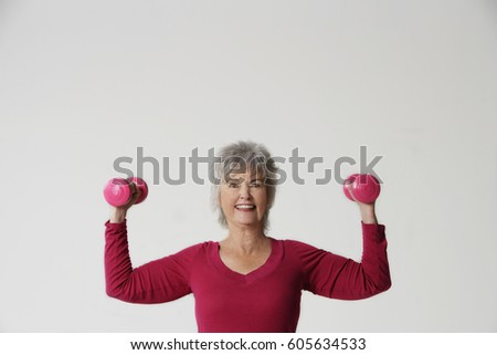 Mature woman lifting weights.