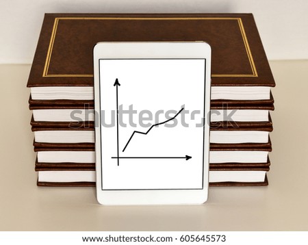 Book with a tablet on a white background