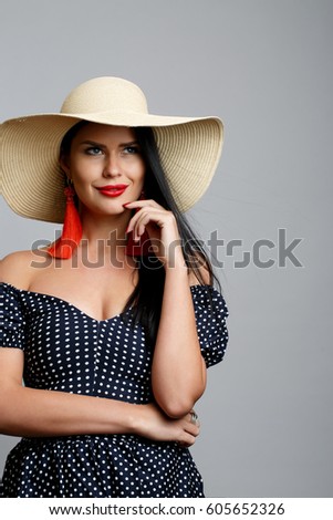 Young beautiful brunette in hat