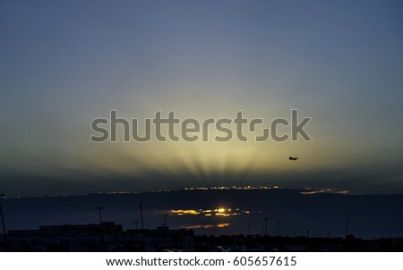 Plane takes off at sunrise background