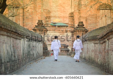 Thai nun is walking on brick way to temple in the morning this picture take from ayutthaya thailand