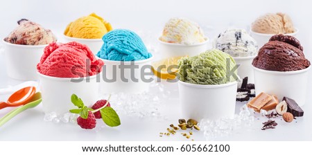 Large selection of artisanal takeaway ice cream in tubs each with the fresh ingredients alongside including raspberry, pistachio, bubblegum, caramel, chocolate, hazelnut and lemon