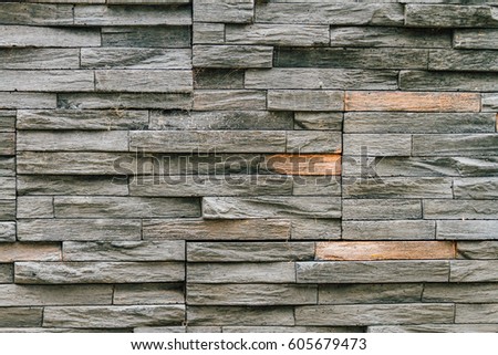 Wall surface with black slabs stacked