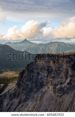 Aerial landscape view of Table Mountain with Black Tusk in the background. Picture taken in Garibaldi, BC, Canada, during a cloudy sunset.