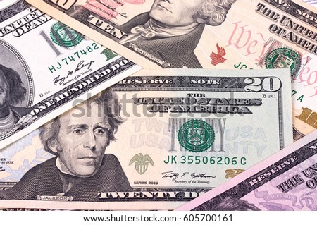 American dollar bills of different denominations abstract background