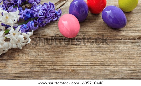 Colorful Easter eggs decoration and copy space on wooden background