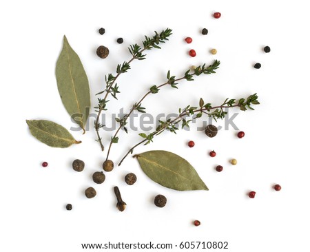 Group of Dry Spices with Thyme and Black Pepper Isolated on White Background Top View Royalty-Free Stock Photo #605710802