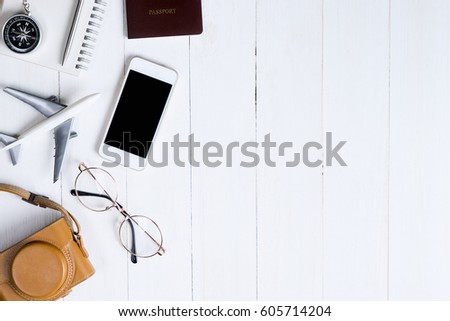 Travel objects flat lay top view on white wooden with copy space for Vacation tourism Poster and banner for  Advertisement design use. Royalty-Free Stock Photo #605714204