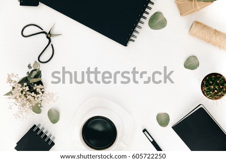 Workspace with notebook, flowers