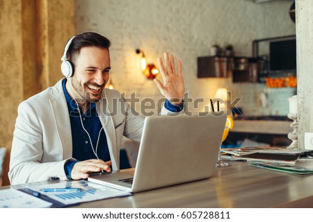 Man have business meeting via video call in a cafe Royalty-Free Stock Photo #605728811