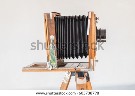 Ryazan, Russia - March 16, 2017: Old vintage big camera of wood and metal on white background close-up side view