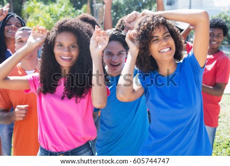 Group of happy dancing hispanic and latin and african american people