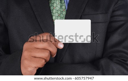 Businessman holding a card