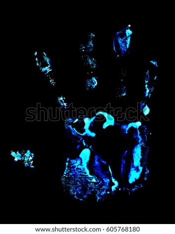 Handprint on black background. Handprint with ultraviolet lamp.