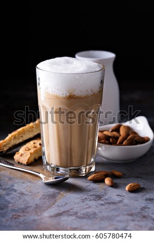 Coffee latte with almond milk and biscotti