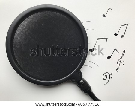 Pop filter and musical notes and melodies with white plain background 