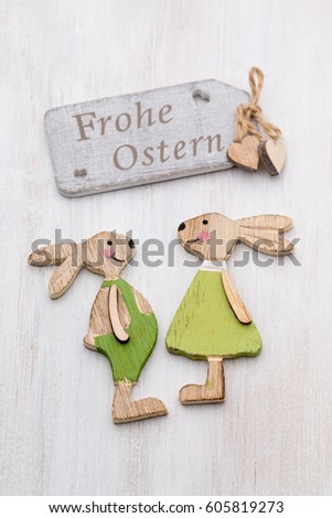 Spring and Easter decor. Wooden symbols bunny, flowers and butterflies.
