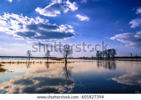 Landscape over the floodplain of a river with a stormy day