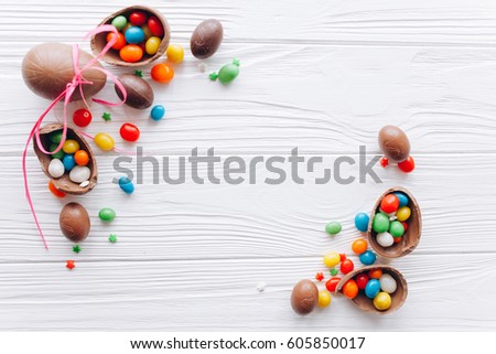 Easter concept. chocolate eggs and  colored sweets on a white background
 Royalty-Free Stock Photo #605850017