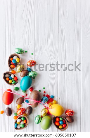 Easter concept. chocolate eggs and  colored sweets on a white background
 Royalty-Free Stock Photo #605850107