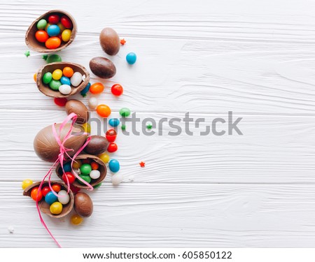 Easter concept. chocolate eggs and  colored sweets on a white background
 Royalty-Free Stock Photo #605850122