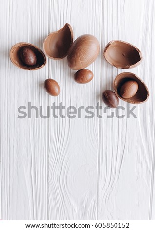 Easter concept. chocolate eggs and  colored sweets on a white background
 Royalty-Free Stock Photo #605850152