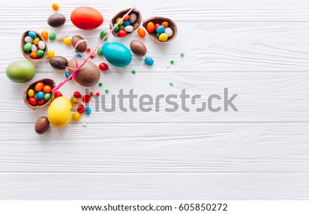 Easter concept. chocolate eggs and  colored sweets on a white background
 Royalty-Free Stock Photo #605850272