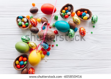 Easter concept. chocolate eggs and  colored sweets on a white background
 Royalty-Free Stock Photo #605850416