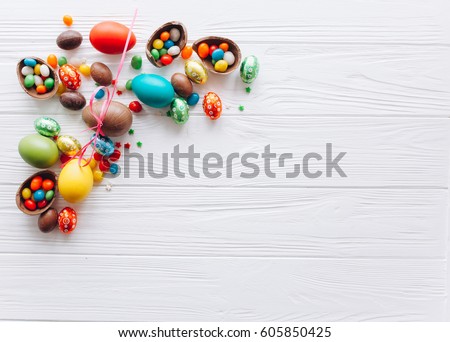 Easter concept. chocolate eggs and  colored sweets on a white background
 Royalty-Free Stock Photo #605850425