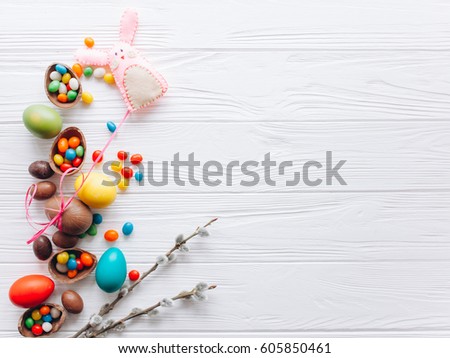 Easter concept. chocolate eggs and  colored sweets on a white background
 Royalty-Free Stock Photo #605850461