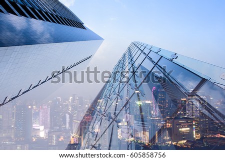 Double exposure of perspective low angle view luxury modern buildings and the city can use for business and finance background Royalty-Free Stock Photo #605858756