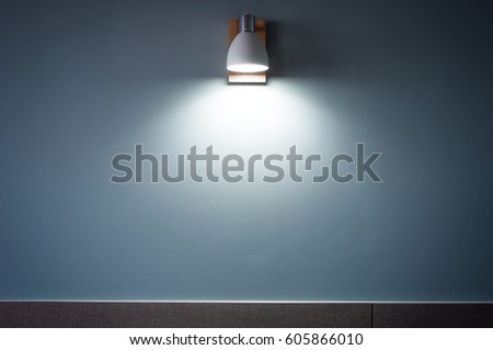 White Light Beam from lamp on blue wallpaper background