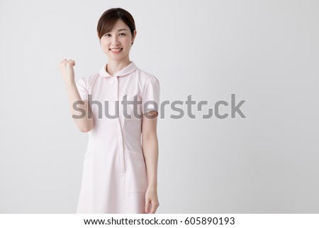 A woman who makes a gut pose, a nurse