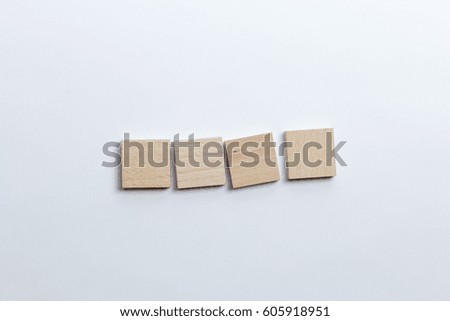 Four blank toy block tiles
