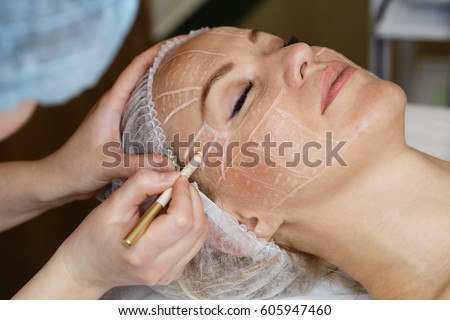 Non-surgical face lifting. SMAS lifting ultrasonic. Facelift. The process of rejuvenation. Spa treatment. Hardware cosmetology. Royalty-Free Stock Photo #605947460