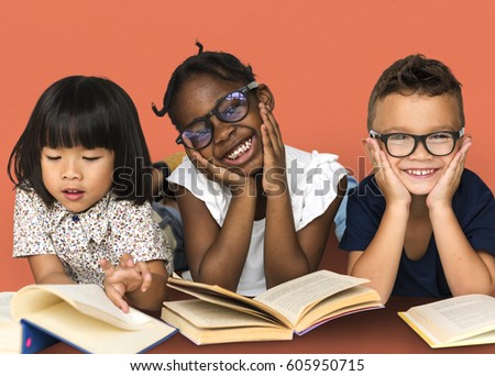 Diverse Group Of Kids Study Read Book Royalty-Free Stock Photo #605950715