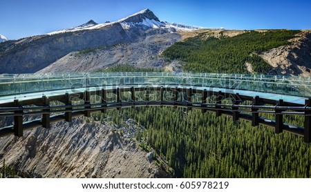 A panoramic view of the glacier skywalk made of glass near the Columbia Icefield, Jasper, Alberta, Canada Royalty-Free Stock Photo #605978219