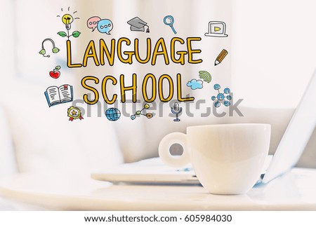 Language School concept with a cup of coffee and a laptop