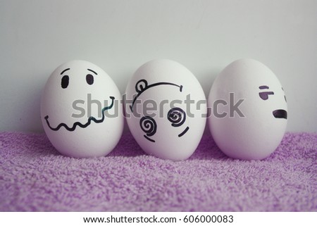 Eggs are funny with faces. Concept of irritation, enrages. Photo for your design on a white background