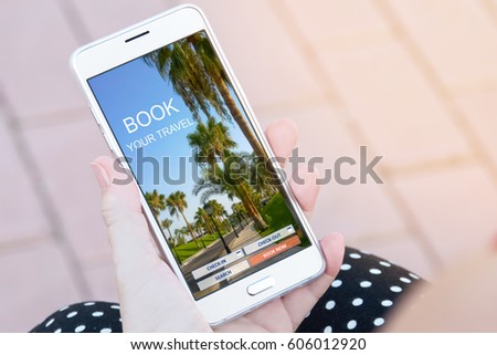 Woman's hand holding modern smartphone with travel business picture, planning vacations, booking  trip