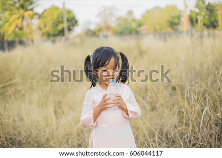 Thirsty Girl Drinking Water Outdoors 